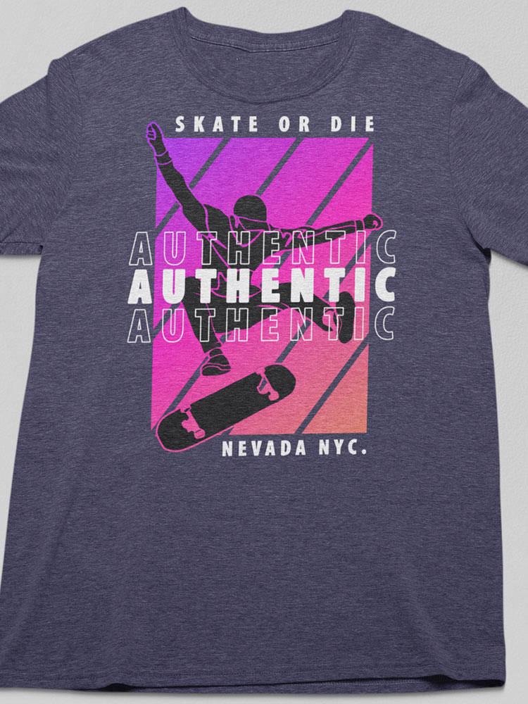 This image shows a heather gray t-shirt with a purple and pink graphic design, including the silhouette of a person skateboarding and the words "Authentic" and "Skate or Die."