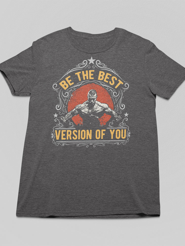 The image shows a gray t-shirt with a motivational graphic featuring a person lifting weights, surrounded by the phrase "BE THE BEST VERSION OF YOU".